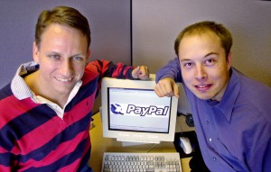 PayPal Chief Executive Officer Peter Thiel, left, and founder Elon Musk, right, pose with the PayPal logo at corporate headquarters in Palo Alto, Calif., Oct. 20, 2000. Online payment provider PayPal Inc. raised $70.2 million in its widely anticipated initial public offering, but a patent infringement lawsuit gave investors reason to be wary as the stock began trading Friday, Feb. 15, 2002 on the Nasdaq Stock Market. After covering expenses, Palo Alto-based PayPal expects to net $61.3 million from the initial sale Thursday of 5.4 million shares at $13 apiece, according to a Securities and Exchange Commission filing. (AP Photo/Paul Sakuma, File)